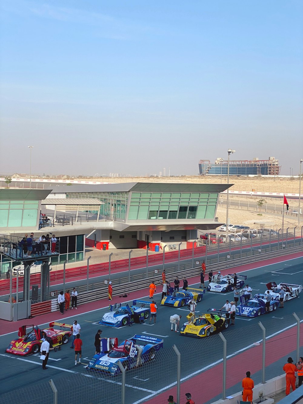 a group of people around a race track