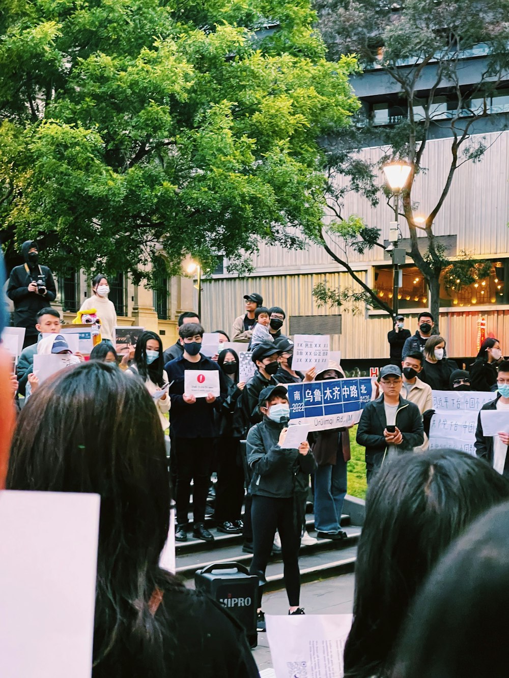 a group of people holding signs