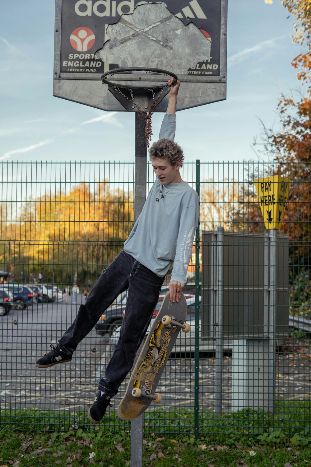 a boy jumping on a skateboard