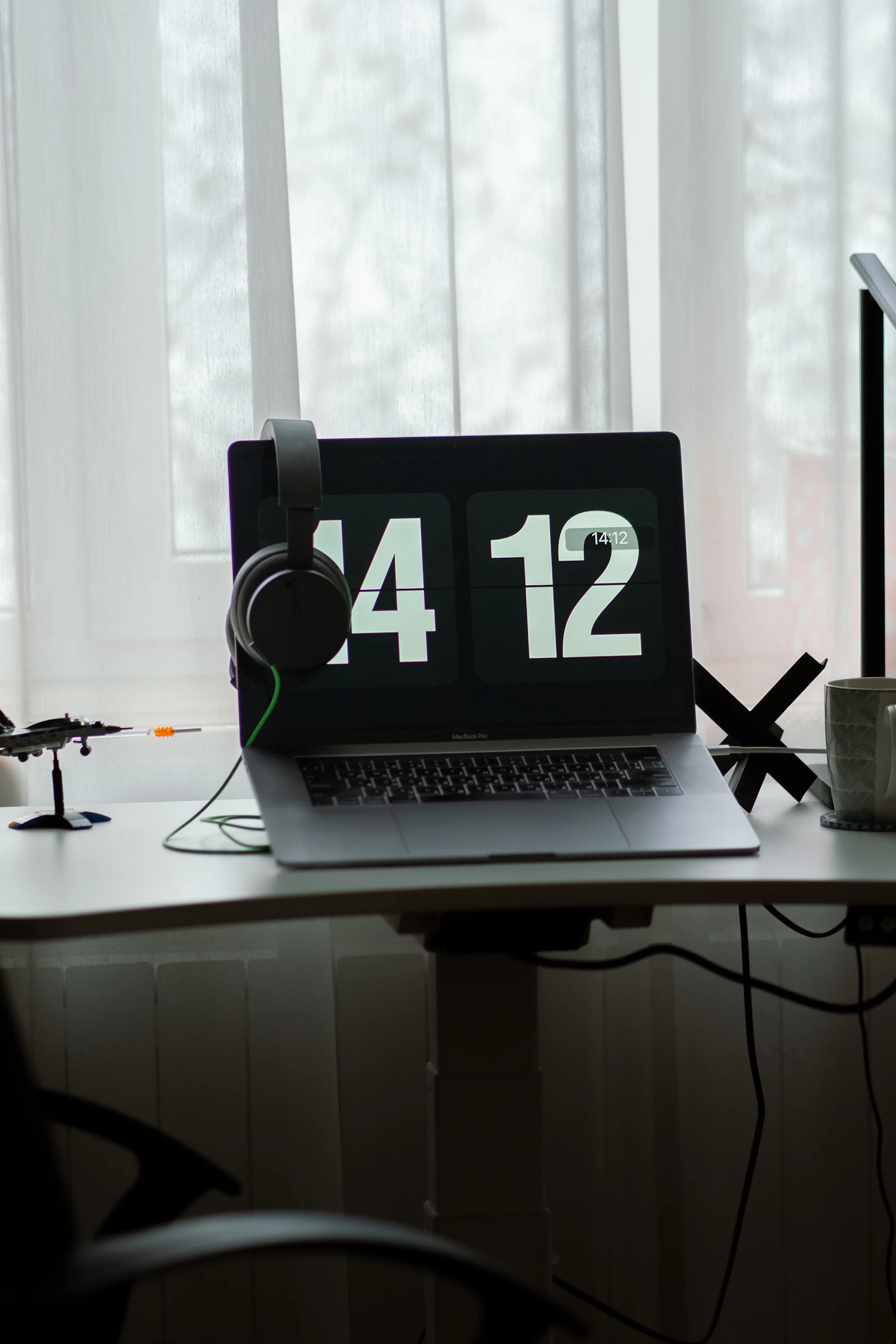 Laptop and desktop workspace representing browser settings and controls