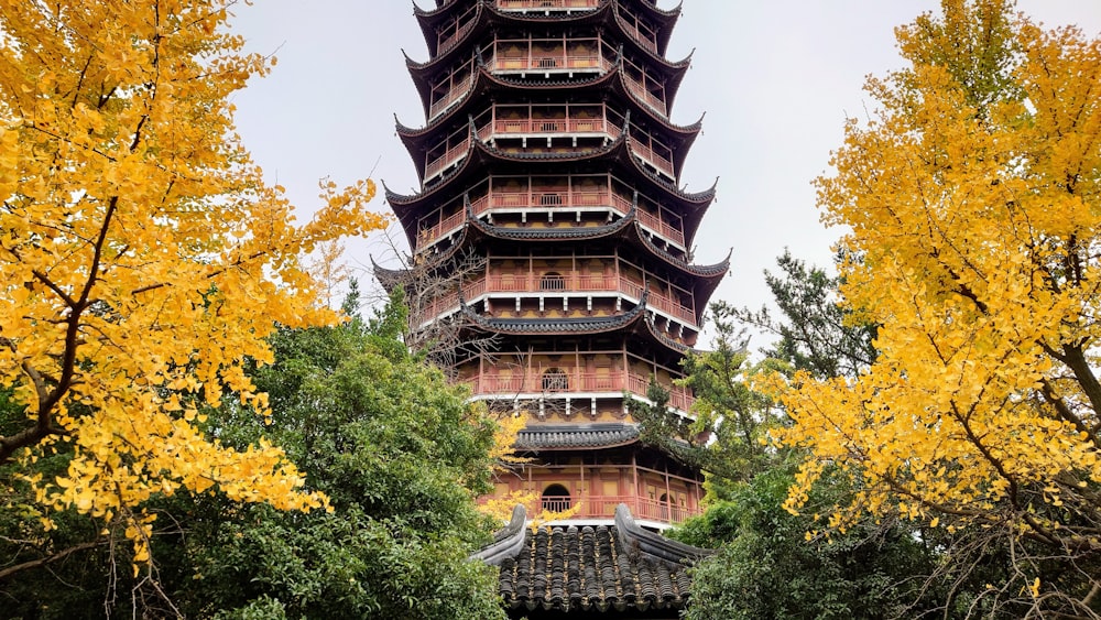 a tall tower with trees around it