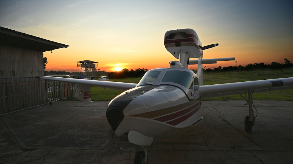 a plane parked on a concrete pad