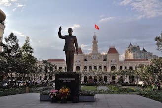 a statue in front of a building