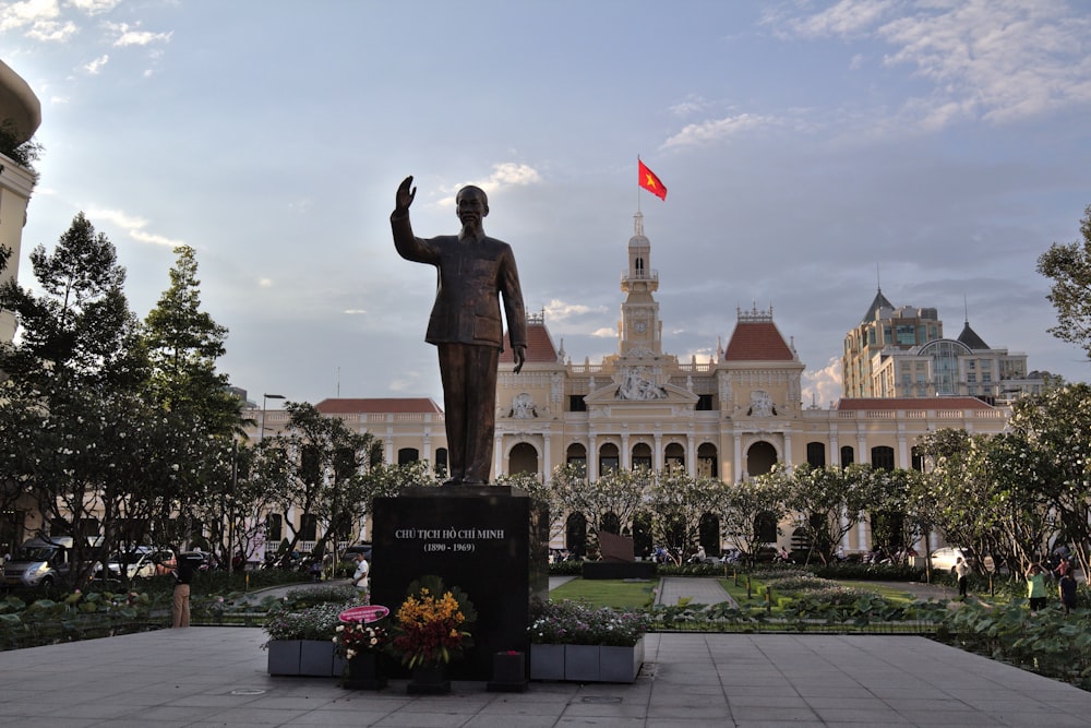 a statue in front of a building