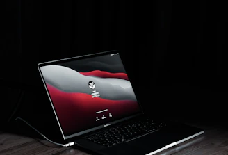 A sleek MacBook screen displaying a secure login interface with a padlock icon.