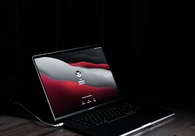 A sleek MacBook screen displaying a secure login interface with a padlock icon.