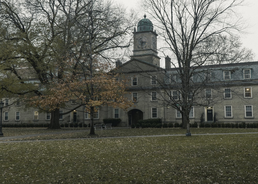 a large building with trees in front of it