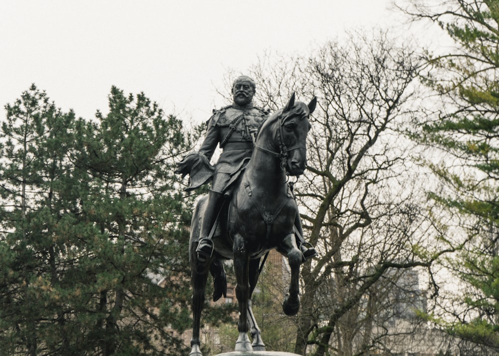 a statue of a person riding a horse