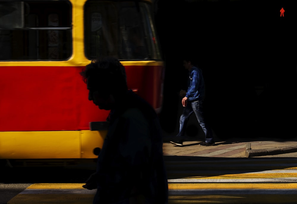 a person walking next to a train