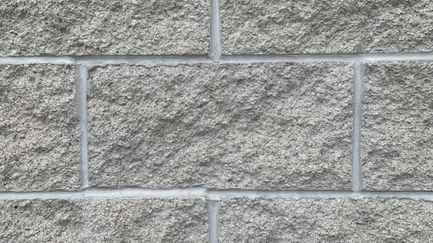 Close-up photo of grey ICF blocks stacked neatly on a construction site in Portugal.