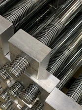 Close-up of steel rods and wire products freshly manufactured at SNG Hardware’s facility.