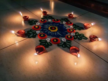 Colorful rangoli designs adorning the temple entrance during Navratri festivities.