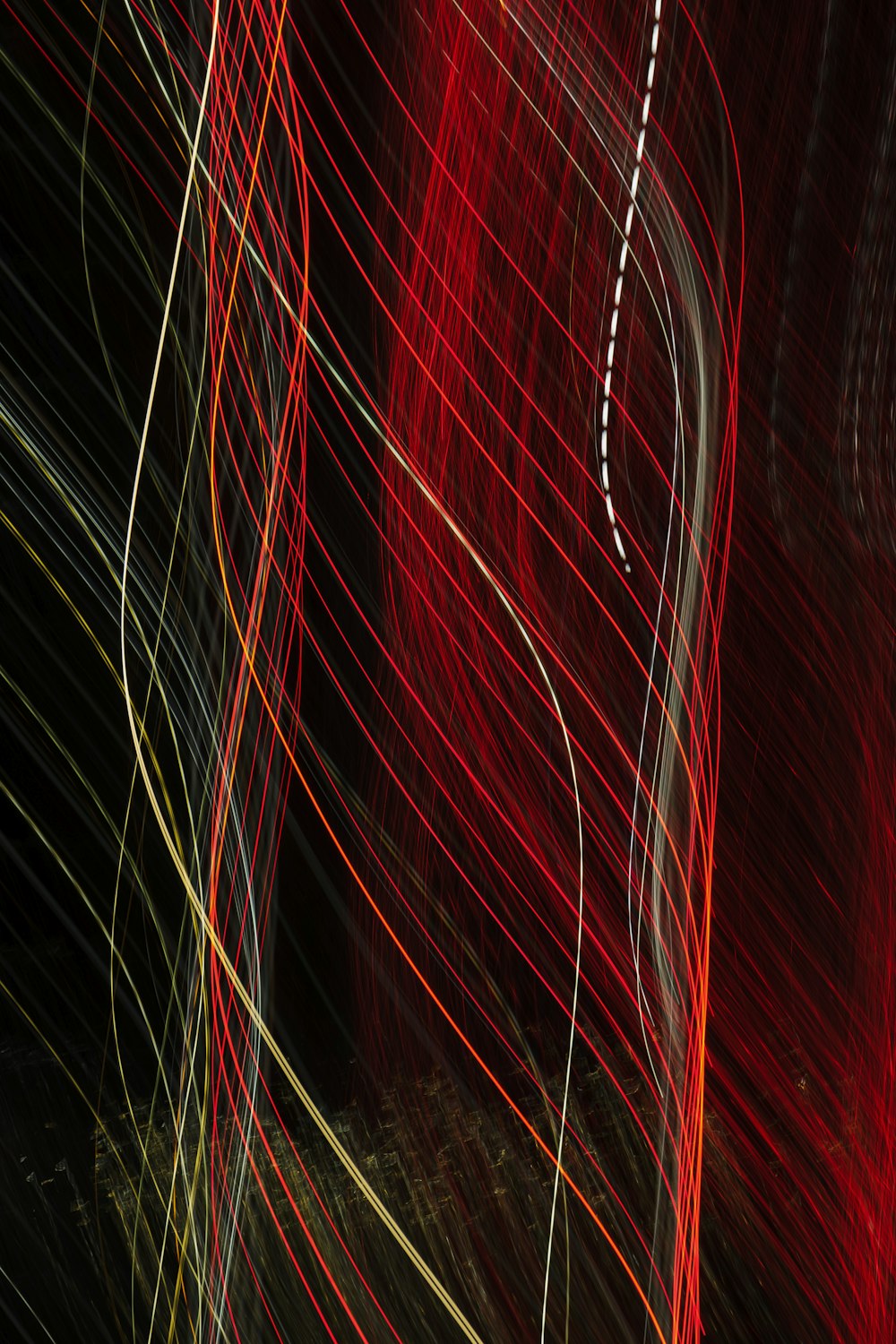 a close up of a red and black string