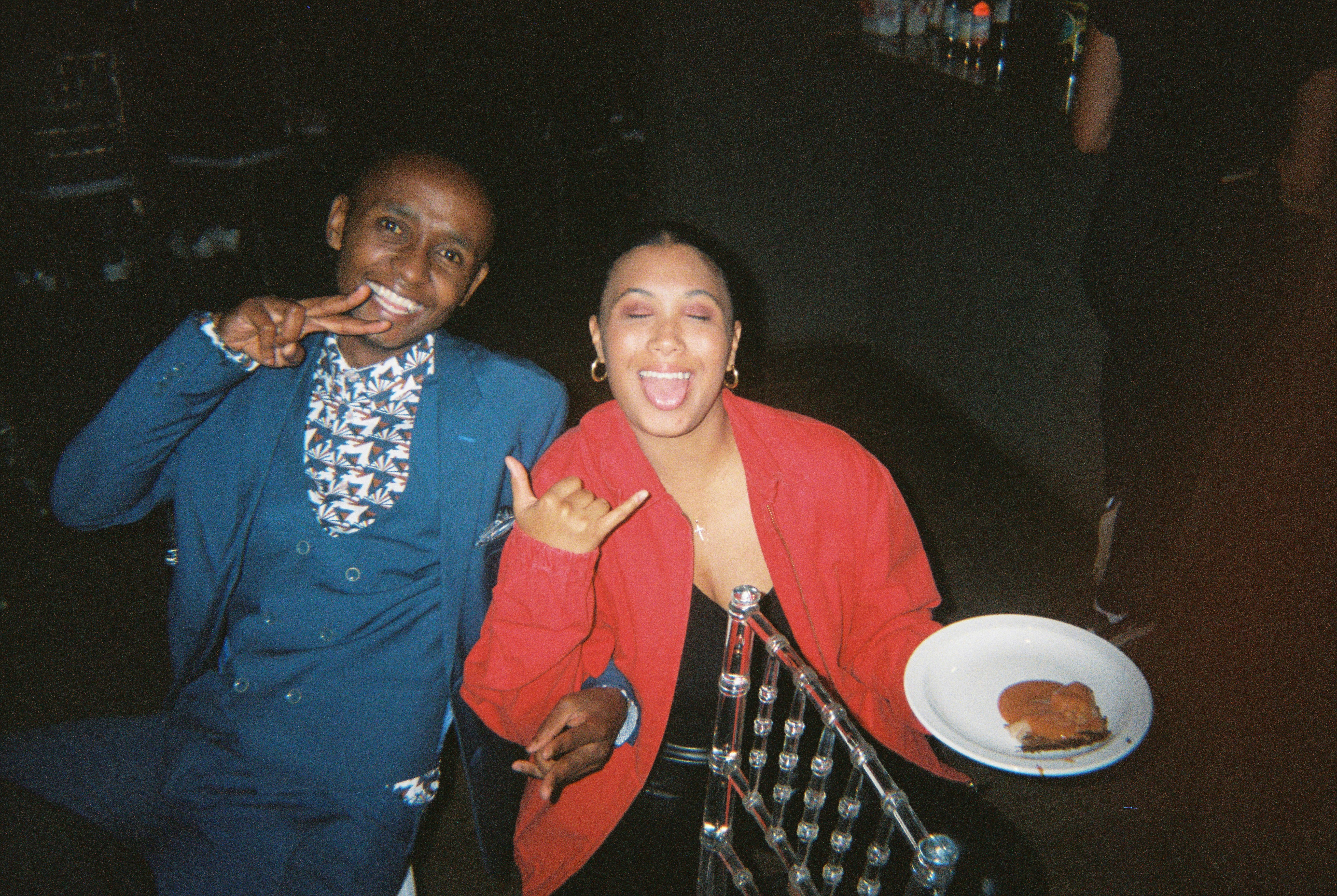 a couple of men posing for the camera