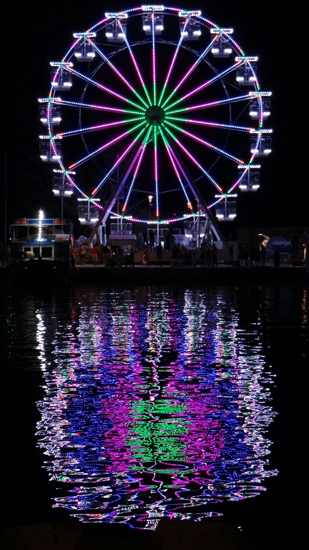 a ferris wheel lit up at night