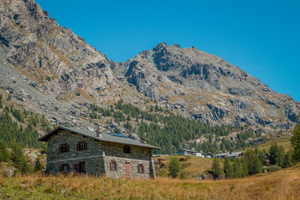 a house in a valley between mountains