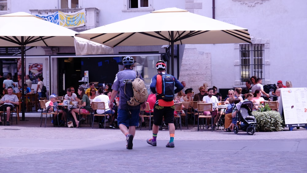 two people wearing helmets