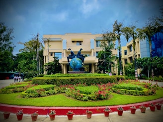 A beautifully landscaped garden surrounding a contemporary building.