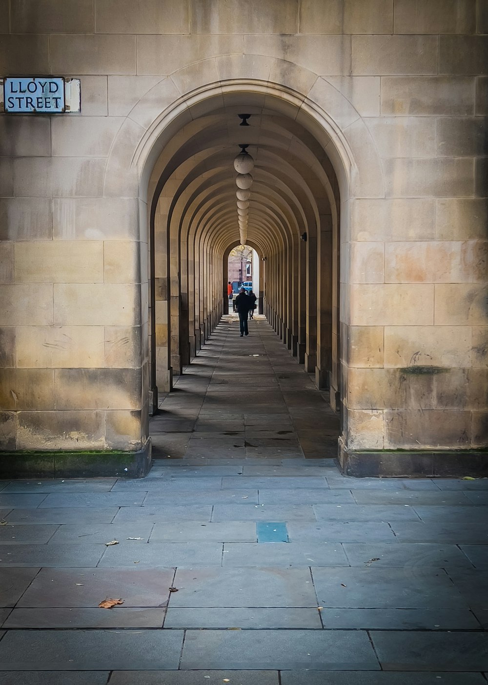 a person walking through a tunnel