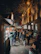 A lively street market bustling with colorful stalls and joyful faces bathed in golden light.