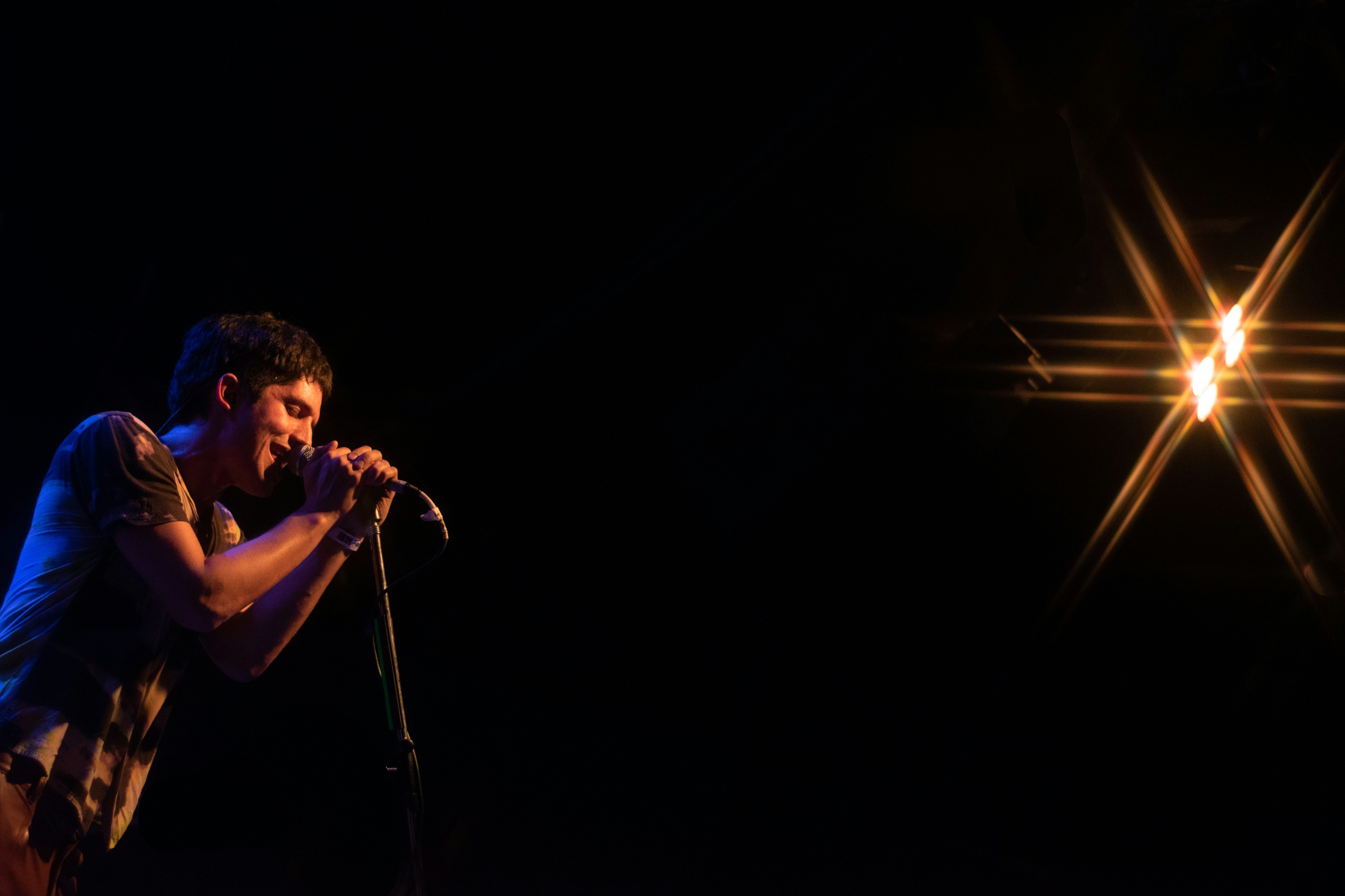 a man singing into a microphone