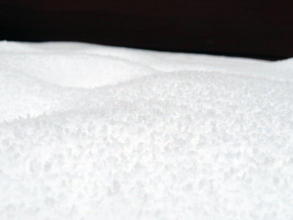 a white surface with a dark background