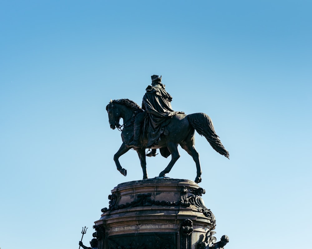 a statue of a man riding a horse