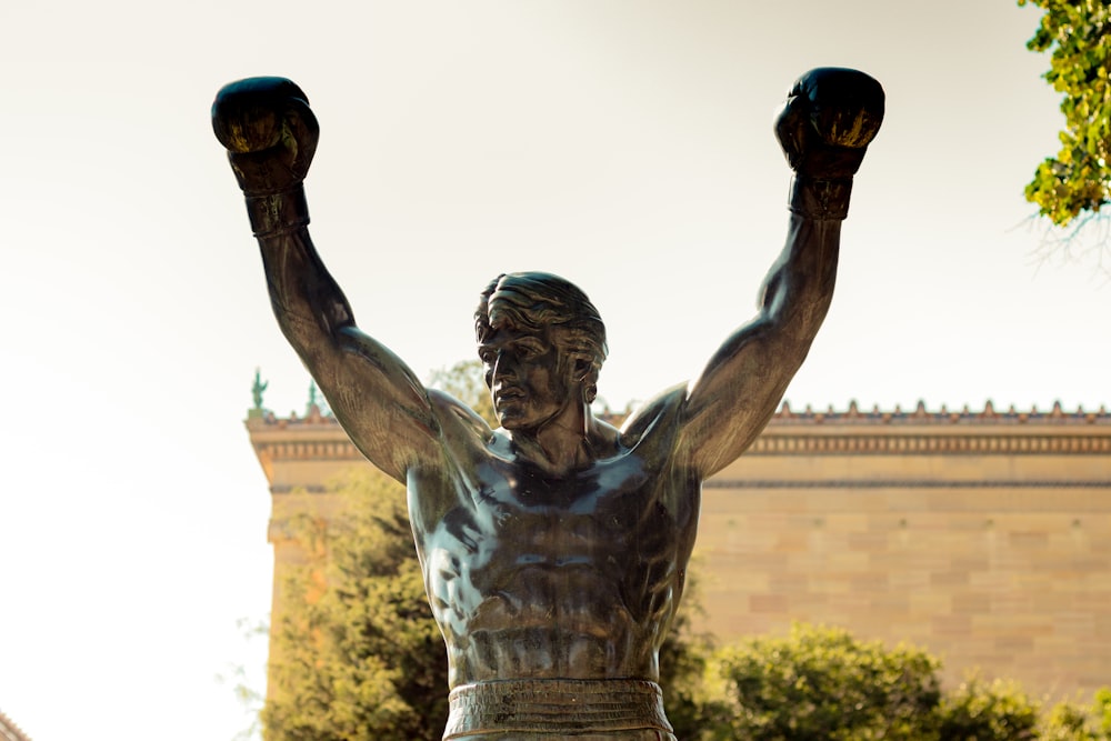 a statue of a person holding a torch