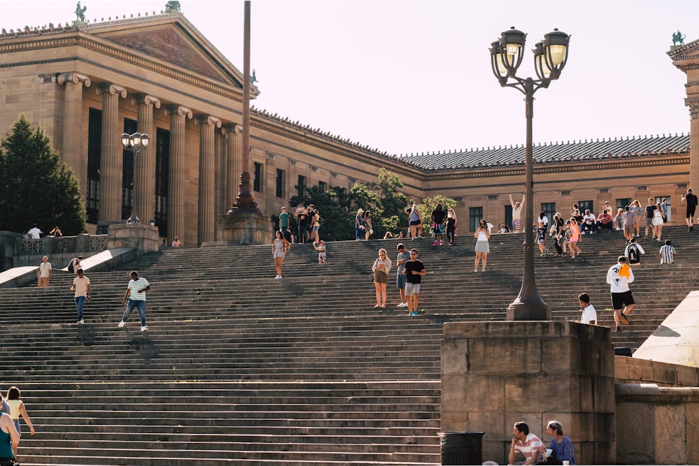 a group of people walking up stairs