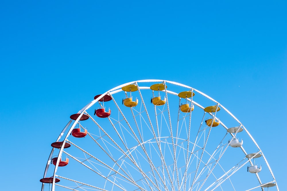 a ferris wheel against a blue sky