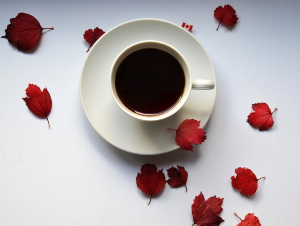 a cup of coffee with strawberries