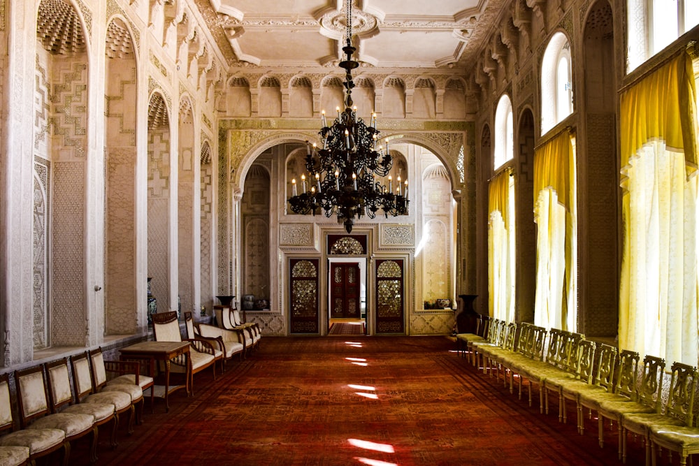 a large room with a chandelier and chairs