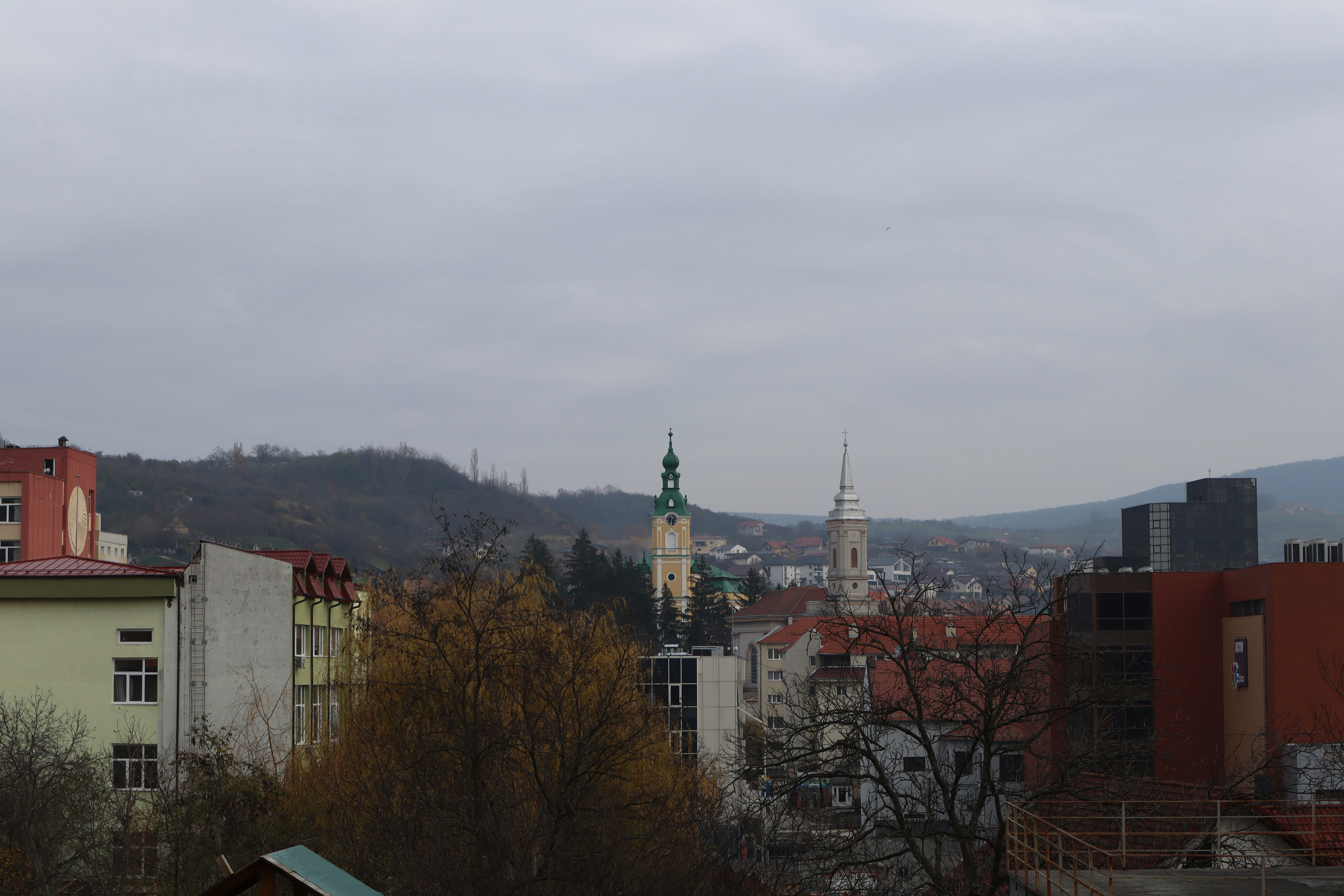 a city with a hill in the background