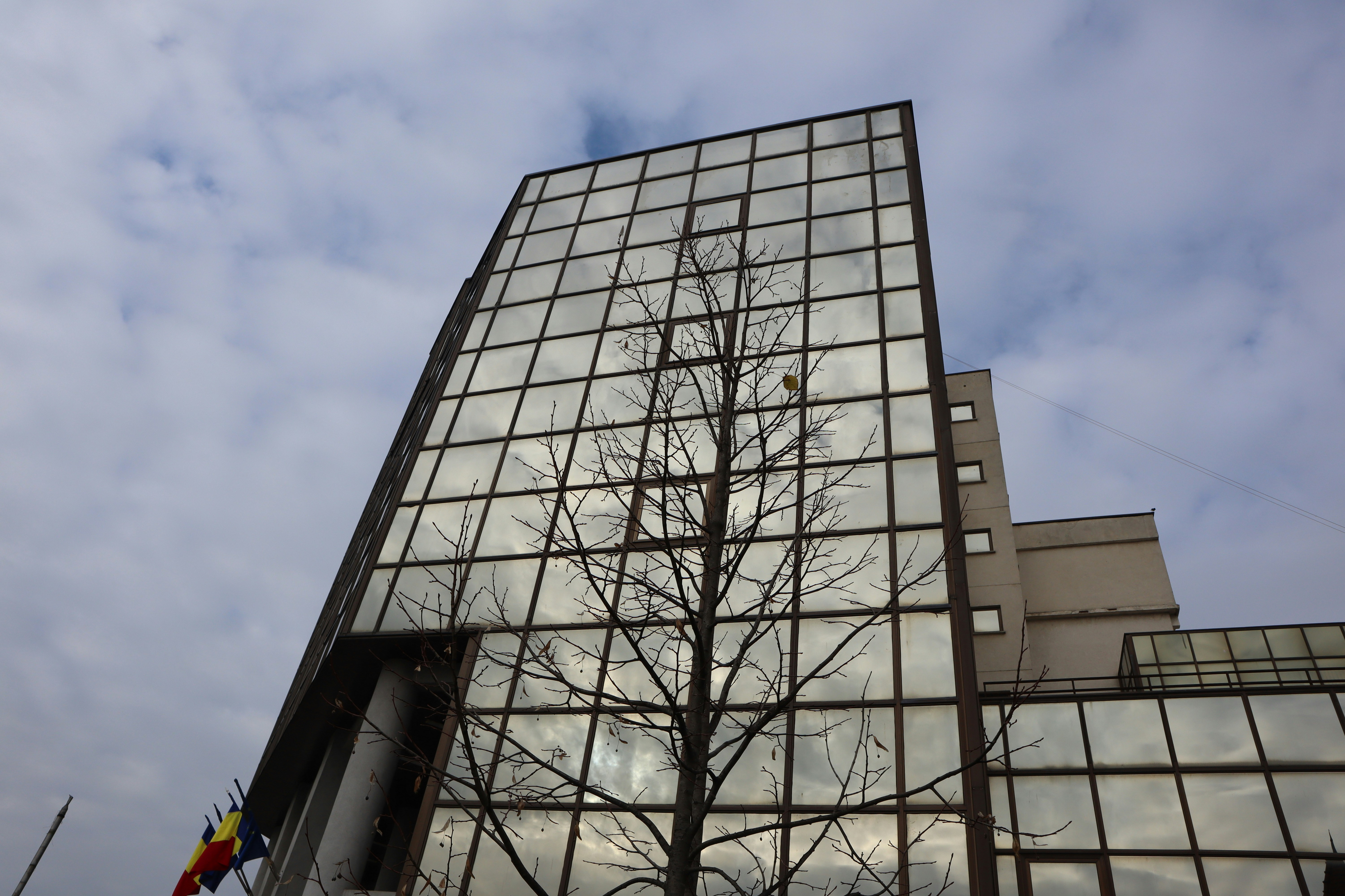 a tall building with a glass front