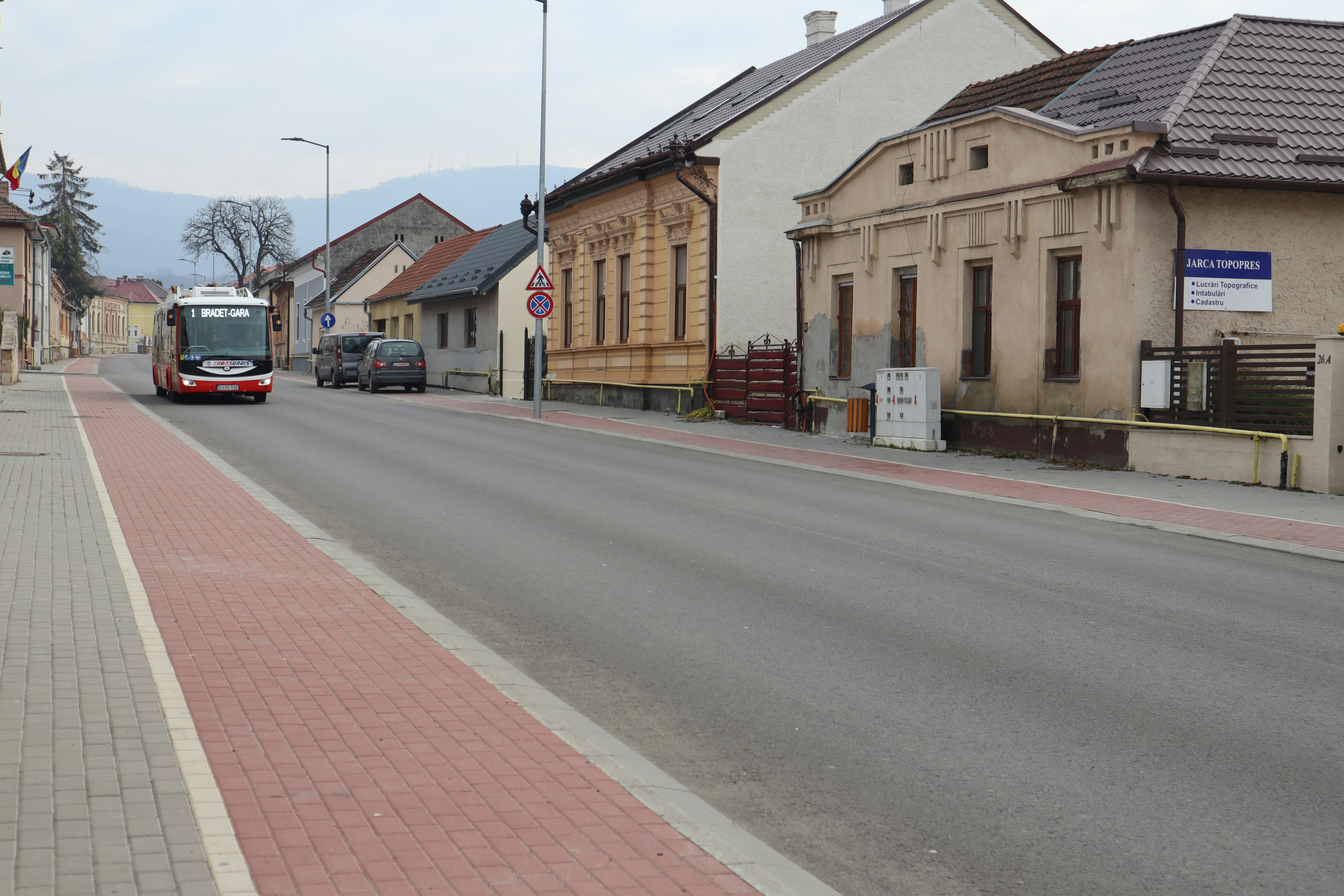 a bus driving down a street