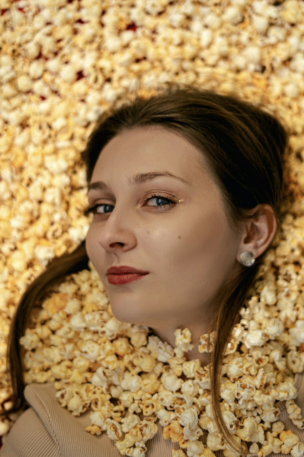 a woman with a large head of gold jewelry