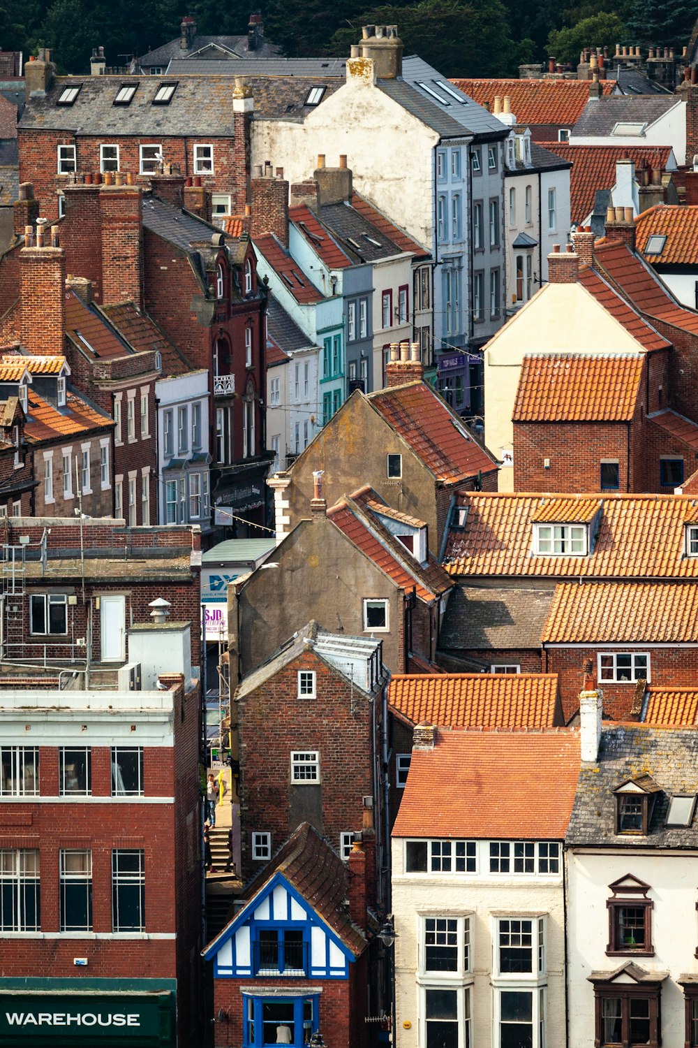 a group of buildings with red roofs