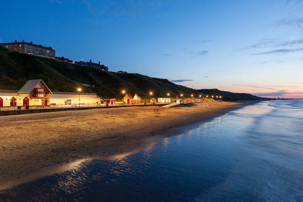 a beach with houses and lights