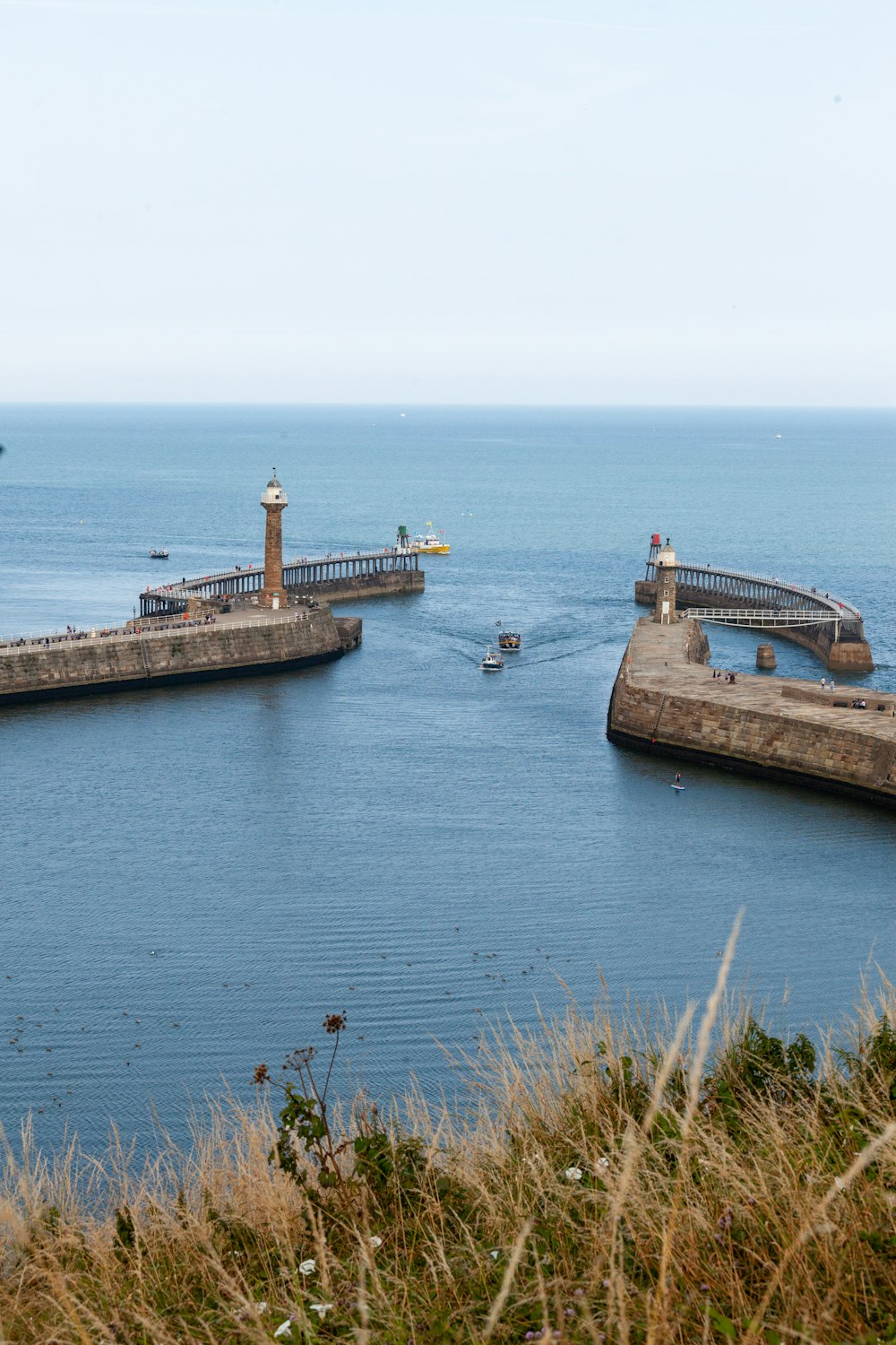 a dock with a lighthouse on it