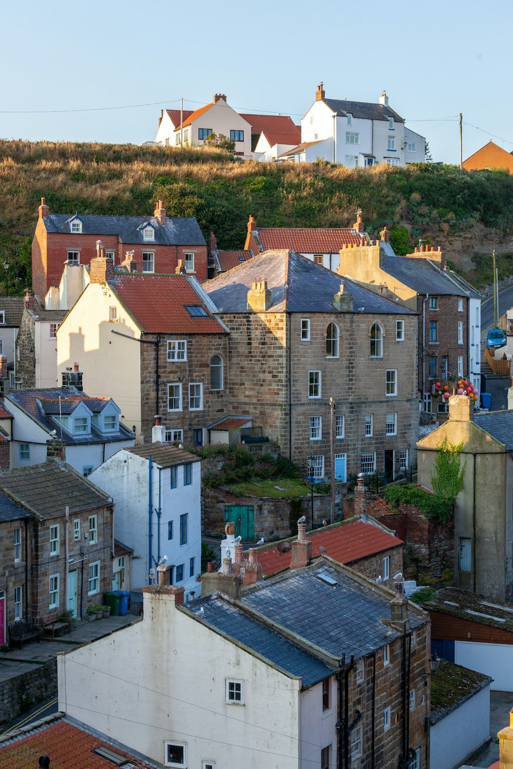 a group of buildings with roofs