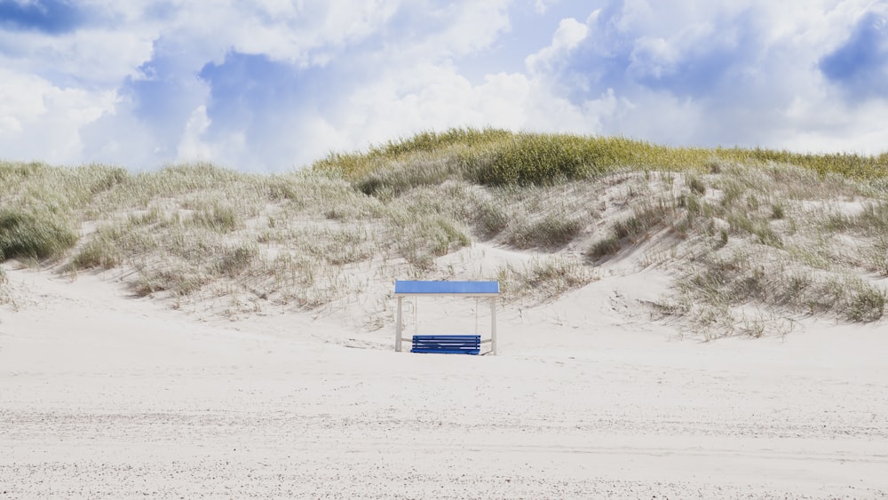 a small building in the sand