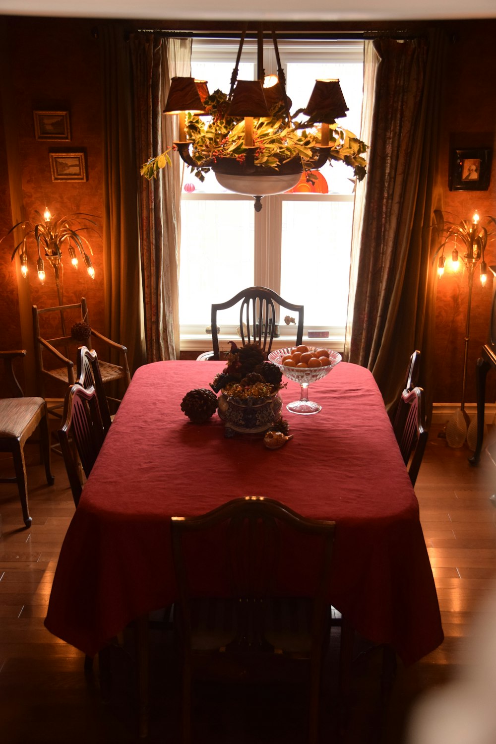 a dining table with a chandelier above it