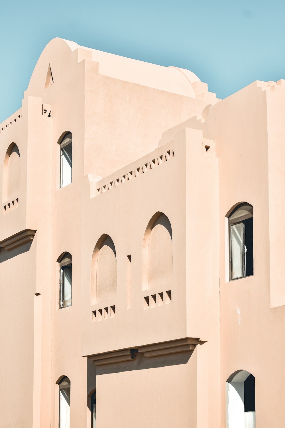 a white building with a blue sky