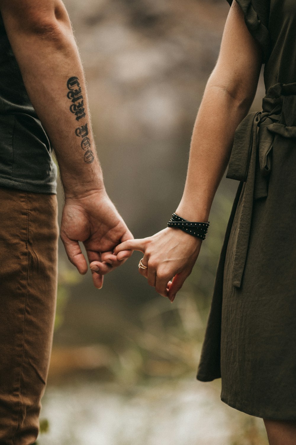 a man and a woman holding hands