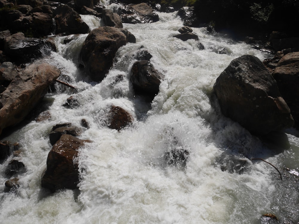 a river with rocks and water flowing over it