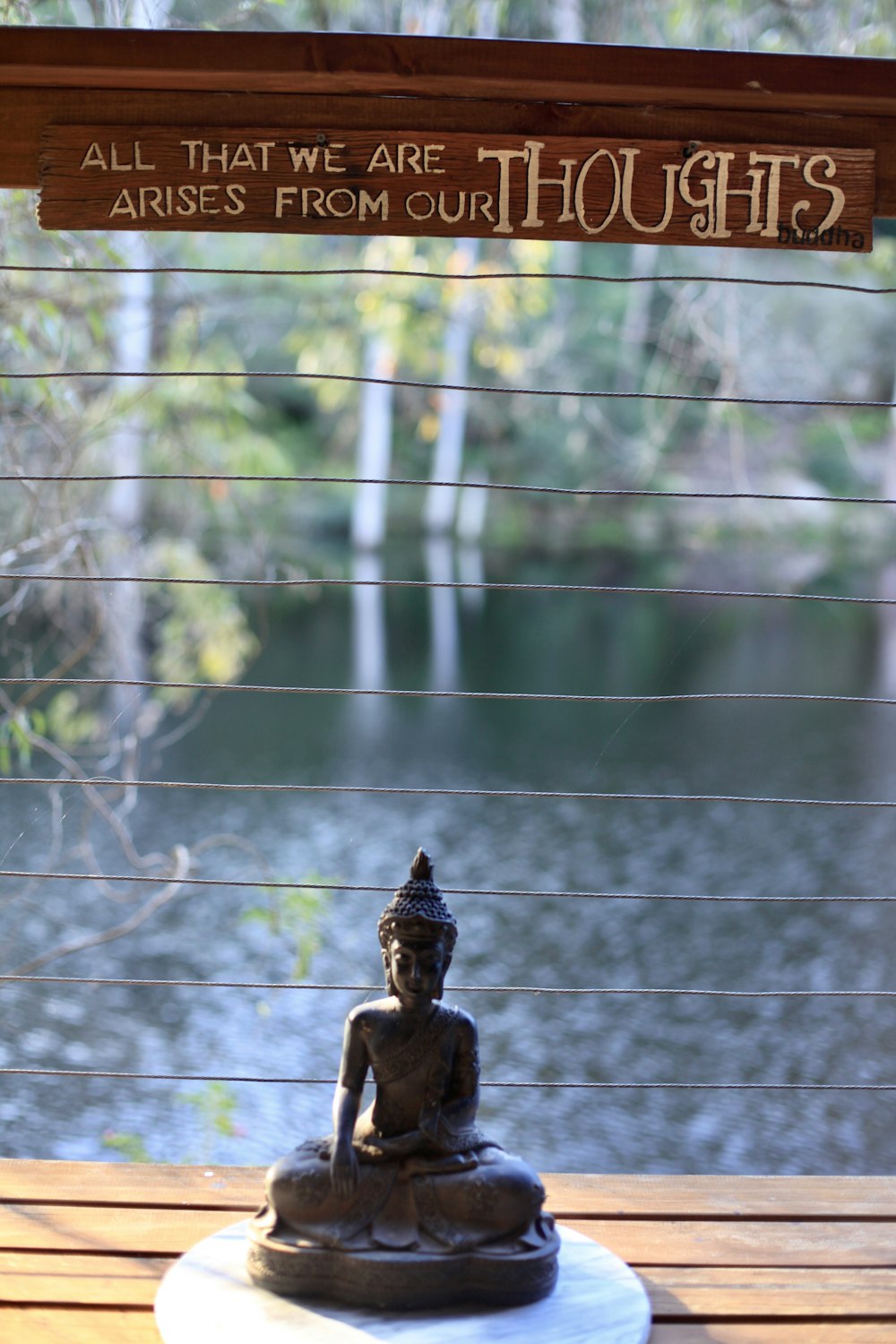 a statue in front of a window