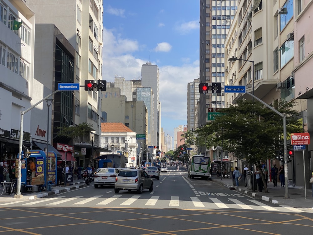 a city street with cars and people