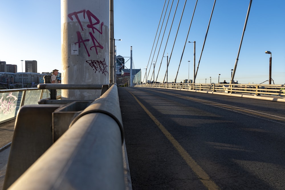 a person standing on a bridge