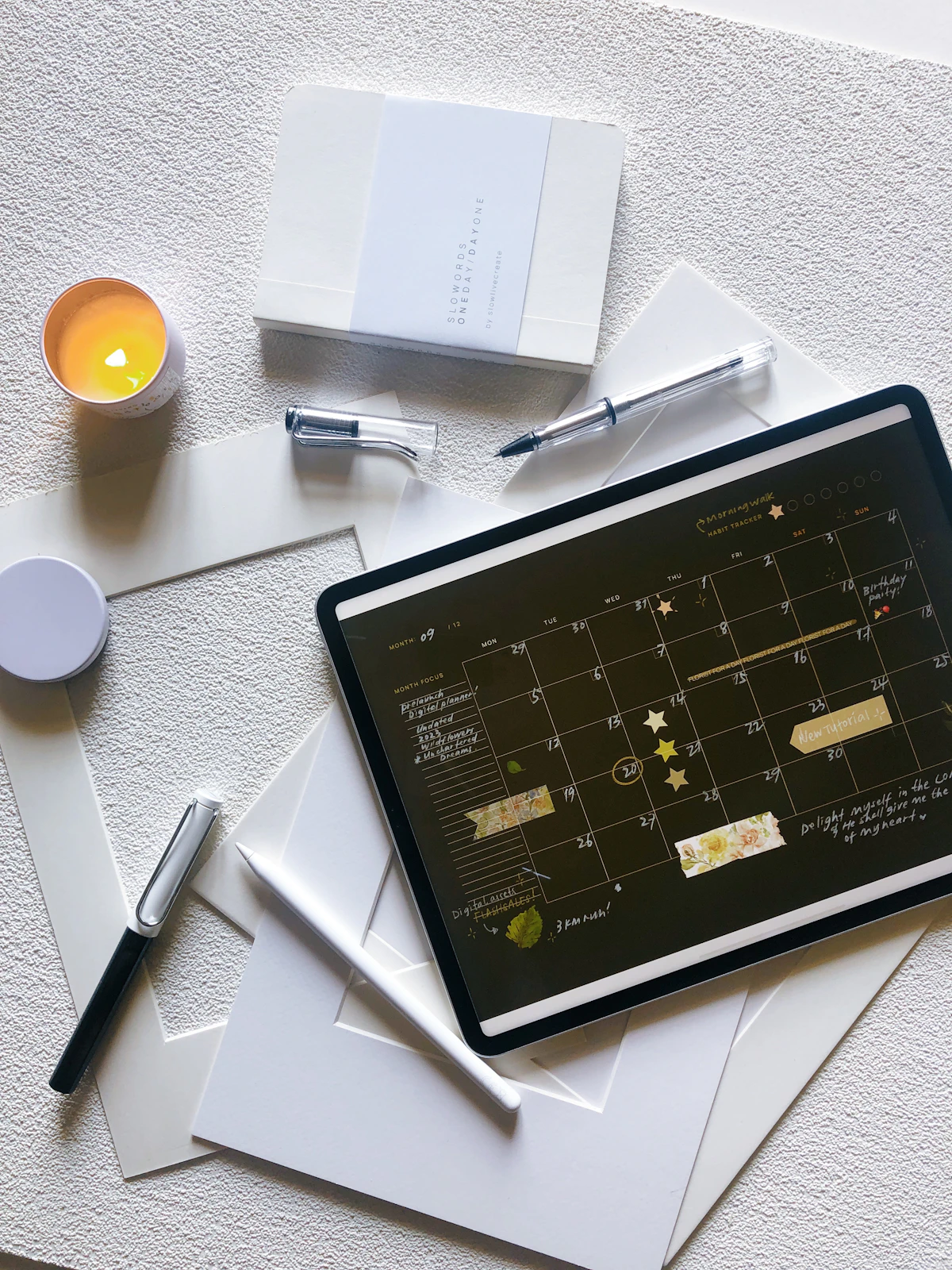Digital pregnancy planner PDF displayed on an iPad and phone showing week-by-week checklists and trackers in a cream and sage theme