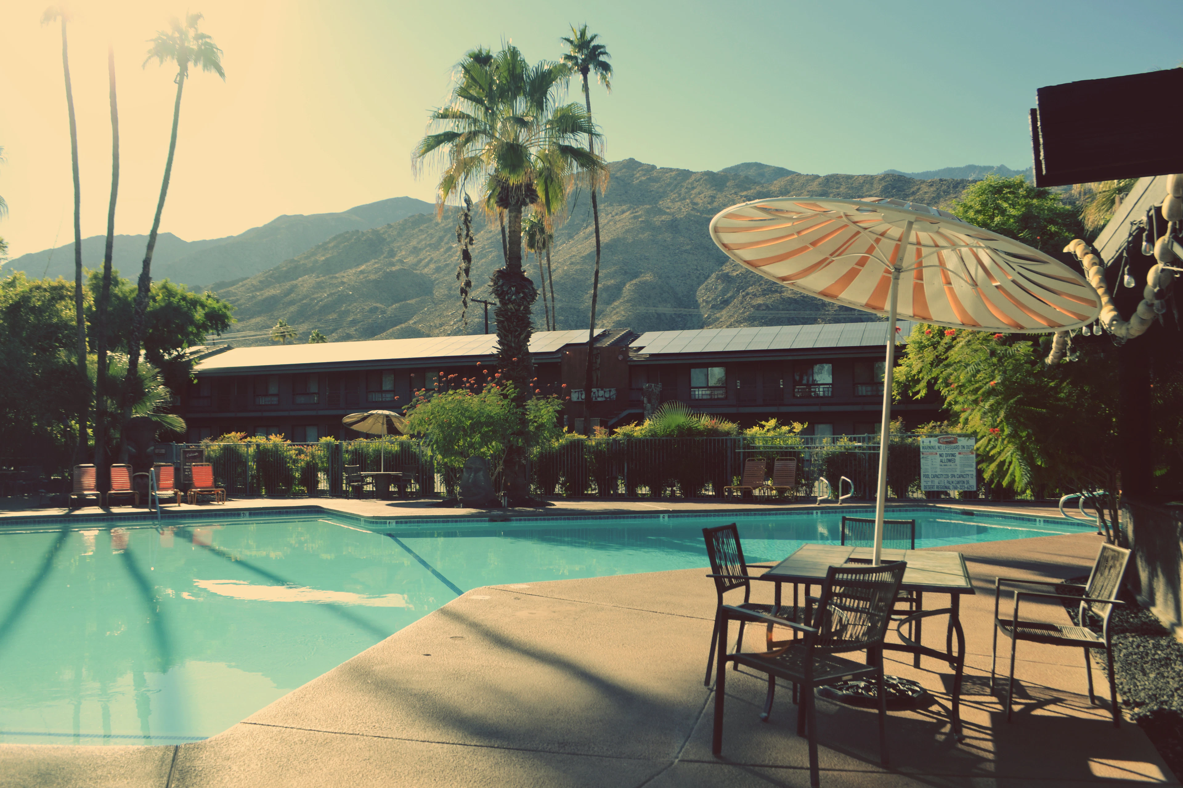Quiet resort pool with umbrellas